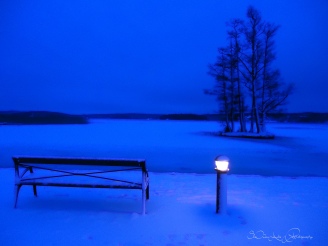 blue morning over the frozen lake